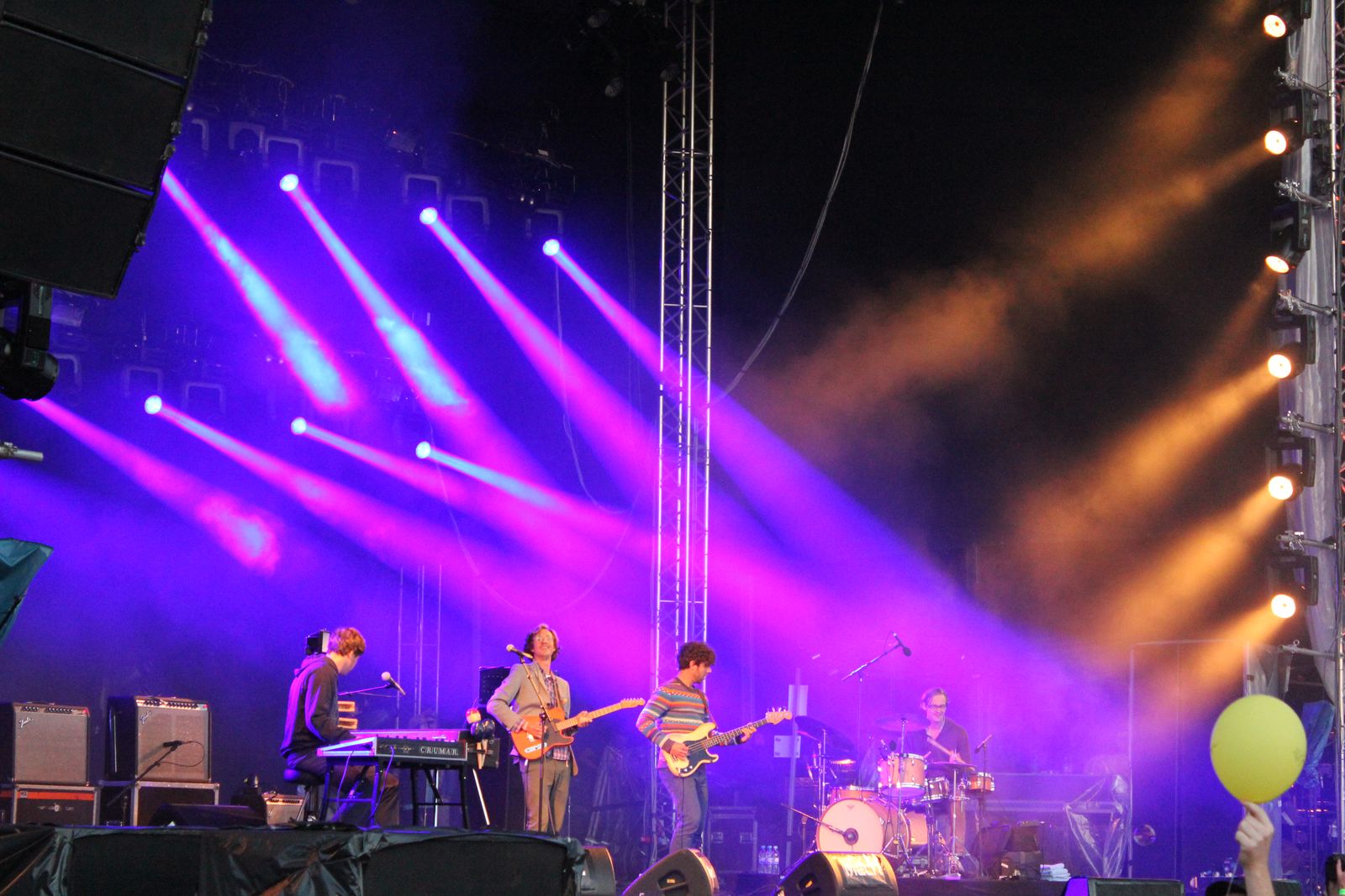 The band on a festival stage under stage lights